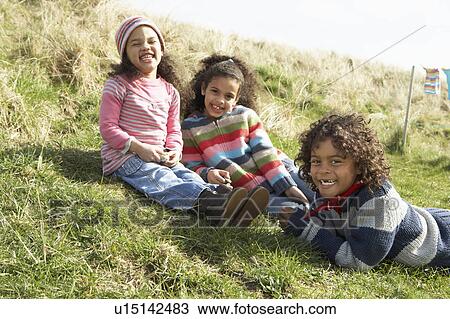 Young Children Sitting Outside In Caravan Park View Large Photo Image Stock Image - Young Children Sitting Outside In Caravan Park. Fotosearch