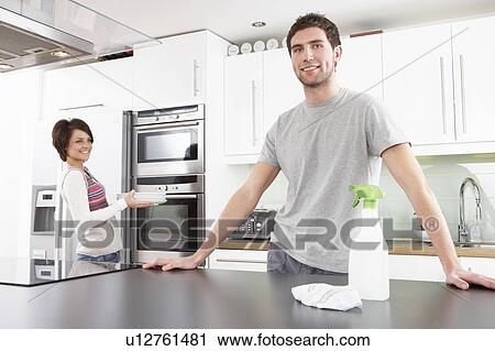 Young Couple Cleaning Cleaning Modern Kitchen View Large Photo Image Stock Image - Young Couple Cleaning Cleaning Modern Kitchen . Fotosearch