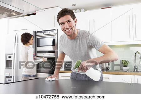 Young Couple Cleaning Cleaning Modern Kitchen View Large Photo Image Stock Photo - Young Couple Cleaning Cleaning Modern Kitchen . Fotosearch