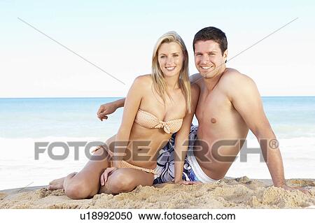 Young Couple Enjoying Beach Holiday View Large Photo Image Stock Image - Young Couple Enjoying Beach Holiday. Fotosearch