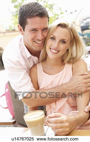Young Couple Enjoying Coffee In Café View Large Photo Image Stock Photography - Young Couple Enjoying Coffee In Café. Fotosearch