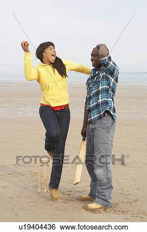Young Couple Playing Cricket On Autumn Beach Holiday View Large Photo Image Stock Photograph - Young Couple Playing Cricket On Autumn Beach Holiday. Fotosearch