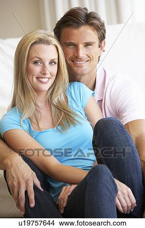 Picture - Young couple posing indoors. Fotosearch