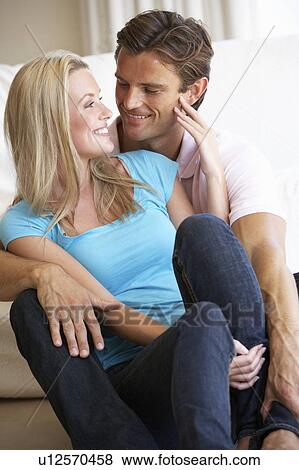 Young couple posing indoors View Large Photo Image Stock Photo - Young couple posing indoors. Fotosearch