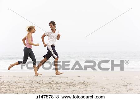 Young Couple Running Along Winter Beach View Large Photo Image Stock Photo - Young Couple Running Along Winter Beach. Fotosearch