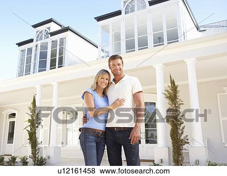 Young Couple Standing Outside Dream Home View Large Photo Image Stock Photo - Young Couple Standing Outside Dream Home. Fotosearch