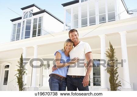 Young Couple Standing Outside Dream Home View Large Photo Image Stock Photo - Young Couple Standing Outside Dream Home. Fotosearch