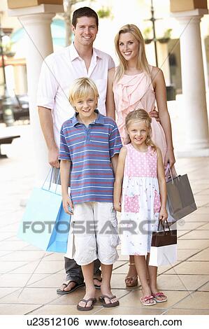 Young Family Enjoying Shopping Trip Together View Large Photo Image Stock Photograph - Young Family Enjoying Shopping Trip Together. Fotosearch