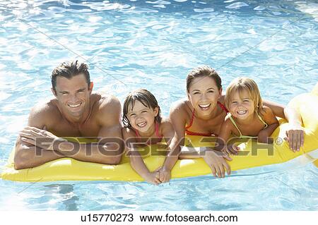 Young family, parents with children, in pool View Large Photo Image Stock Image - Young family, parents with children, in pool. Fotosearch