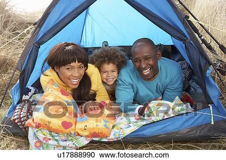 Young Family Relaxing Inside Tent On Camping Holiday View Large Photo Image Stock Image - Young Family Relaxing Inside Tent On Camping Holiday. Fotosearch