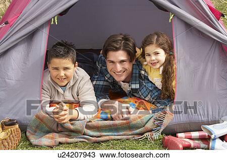 Young Family Relaxing Inside Tent On Camping Holiday View Large Photo Image Stock Image - Young Family Relaxing Inside Tent On Camping Holiday. Fotosearch