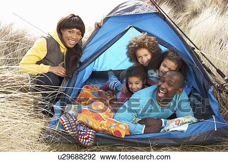 Young Family Relaxing Inside Tent On Camping Holiday View Large Photo Image Stock Image - Young Family Relaxing Inside Tent On Camping Holiday. Fotosearch