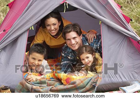Young Family Relaxing Inside Tent On Camping Holiday View Large Photo Image Stock Photo - Young Family Relaxing Inside Tent On Camping Holiday. Fotosearch