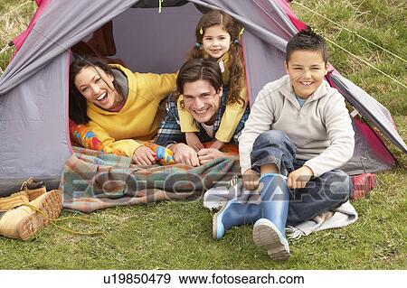 Young Family Relaxing Inside Tent On Camping Holiday View Large Photo Image Stock Photo - Young Family Relaxing Inside Tent On Camping Holiday. Fotosearch