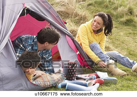 Young Family Relaxing Inside Tent On Camping Holiday View Large Photo Image Stock Photography - Young Family Relaxing Inside Tent On Camping Holiday. Fotosearch