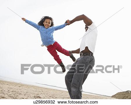 Young Family Relaxing On Beach Camping Holiday View Large Photo Image Stock Image - Young Family Relaxing On Beach Camping Holiday. Fotosearch