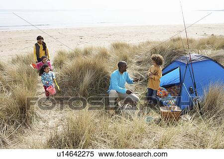 Young Family Relaxing On Beach Camping Holiday View Large Photo Image Stock Photography - Young Family Relaxing On Beach Camping Holiday. Fotosearch