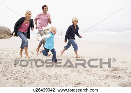 Young Family Running Along Winter Beach View Large Photo Image Stock Image - Young Family Running Along Winter Beach. Fotosearch