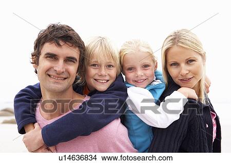 Young Family Sitting On Winter Beach View Large Photo Image Picture - Young Family Sitting On Winter Beach. Fotosearch