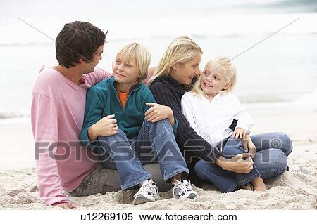 Young Family Sitting On Winter Beach View Large Photo Image Stock Photography - Young Family Sitting On Winter Beach. Fotosearch
