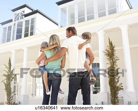 Young Family Standing Outside Dream Home View Large Photo Image Stock Image - Young Family Standing Outside Dream Home. Fotosearch