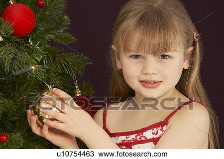 Young Girl Decorating Christmas Tree View Large Photo Image Stock Image - Young Girl Decorating Christmas Tree. Fotosearch