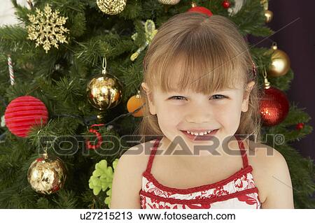 Young Girl Decorating Christmas Tree View Large Photo Image Stock Image - Young Girl Decorating Christmas Tree. Fotosearch