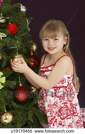 Young Girl Decorating Christmas Tree View Large Photo Image Stock Photography - Young Girl Decorating Christmas Tree. Fotosearch
