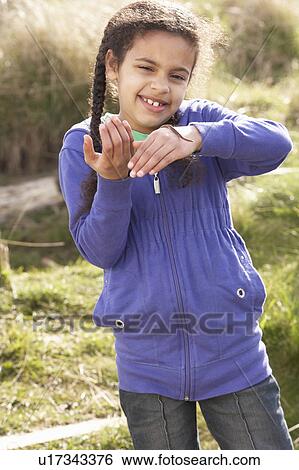 Young Girl Holding Worm Outdoors View Large Photo Image Stock Photograph - Young Girl Holding Worm Outdoors. Fotosearch
