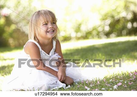 Picture - Young girl posing in park. Fotosearch