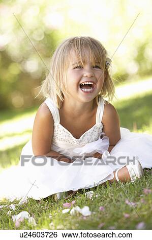 Young girl posing in park View Large Photo Image Stock Photograph - Young girl posing in park. Fotosearch