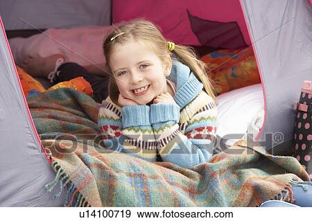 Young Girl Relaxing Inside Tent On Camping Holiday View Large Photo Image Stock Photo - Young Girl Relaxing Inside Tent On Camping Holiday. Fotosearch