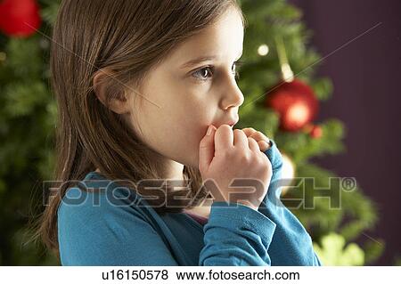 Young Girl Standing In Front Of Christmas Tree View Large Photo Image Stock Photo - Young Girl Standing In Front Of Christmas Tree. Fotosearch