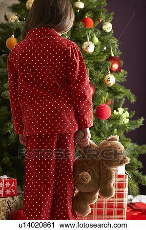 Young Girl Standing With Teddy Bear In Front Of Christmas Tree View Large Photo Image Stock Image - Young Girl Standing With Teddy Bear In Front Of Christmas Tree. Fotosearch