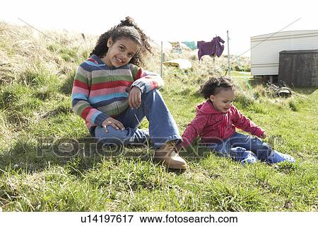 Young Girls Sitting Outside In Caravan Park View Large Photo Image Stock Photo - Young Girls Sitting Outside In Caravan Park. Fotosearch