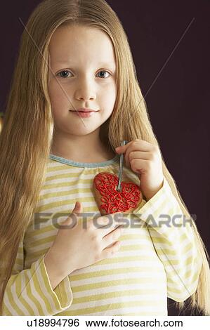 Young Holding Heart Shaped Cookie In Studio View Large Photo Image Stock Photograph - Young Holding Heart Shaped Cookie In Studio. Fotosearch