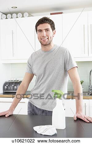 Young Man Cleaning Modern Kitchen View Large Photo Image Stock Image - Young Man Cleaning Modern Kitchen . Fotosearch