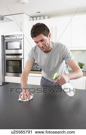 Young Man Cleaning Modern Kitchen View Large Photo Image Stock Image - Young Man Cleaning Modern Kitchen . Fotosearch