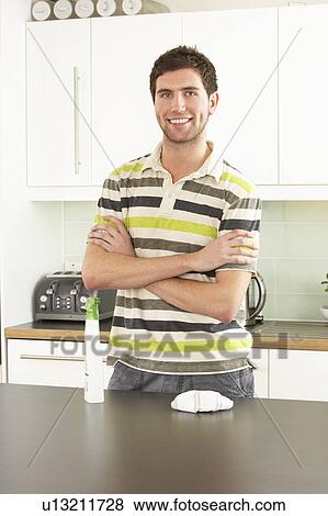 Young Man Cleaning Modern Kitchen View Large Photo Image Stock Photo - Young Man Cleaning Modern Kitchen . Fotosearch
