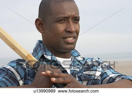 Young Man Playing Cricket On Autumn Beach Holiday View Large Photo Image Stock Photo - Young Man Playing Cricket On Autumn Beach Holiday. Fotosearch