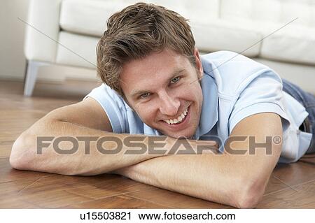 Young Man Relaxing At Home View Large Photo Image Stock Image - Young Man Relaxing At Home. Fotosearch