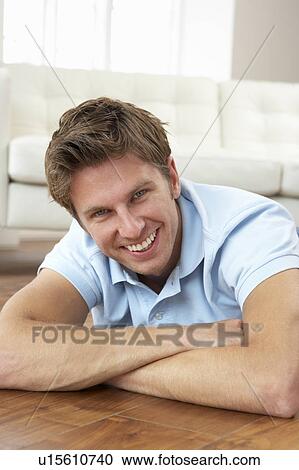 Stock Image - Young Man Relaxing At Home. Fotosearch