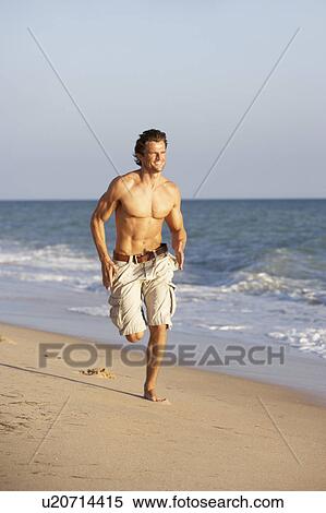 Young Man Running Along Summer Beach View Large Photo Image Stock Photography - Young Man Running Along Summer Beach. Fotosearch