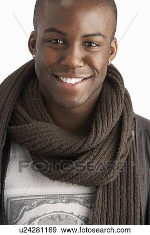 Stock Photo - Young Man Wearing Warm Winter Clothing In Studio. Fotosearch