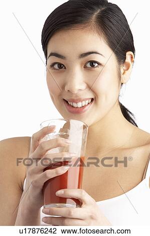 Young Woman Enjoying Healthy Drink In Studio View Large Photo Image Stock Image - Young Woman Enjoying Healthy Drink In Studio. Fotosearch
