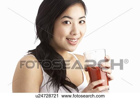 Young Woman Enjoying Healthy Drink In Studio View Large Photo Image Stock Image - Young Woman Enjoying Healthy Drink In Studio. Fotosearch