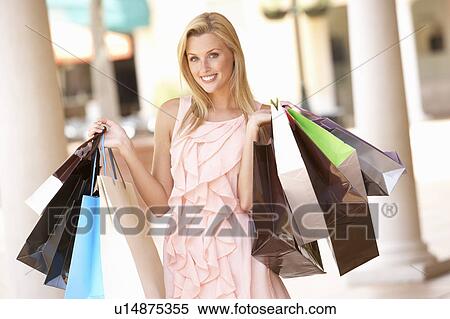 Stock Photography - Young Woman Enjoying Shopping Trip . Fotosearch