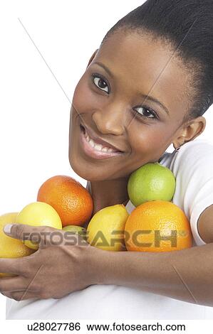 Young Woman Holding Citrus Fruit In Studio View Large Photo Image Stock Photograph - Young Woman Holding Citrus Fruit In Studio. Fotosearch