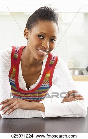 Young Woman Relaxing In Modern Kitchen View Large Photo Image Picture - Young Woman Relaxing In Modern Kitchen . Fotosearch