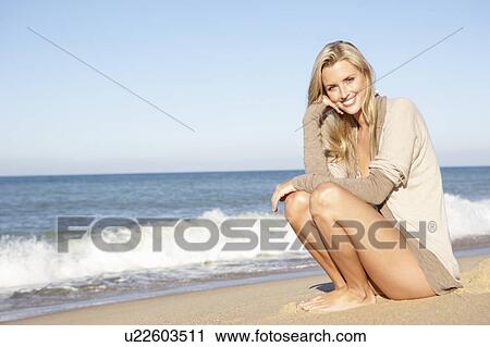 Young Woman Relaxing On Beach View Large Photo Image Stock Image - Young Woman Relaxing On Beach. Fotosearch